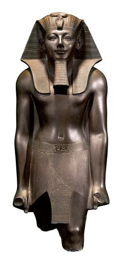 an egyptian statue is shown against a white background