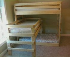 a bunk bed with two sets of mattresses on the bottom and one set of stairs to the top