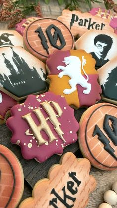 decorated cookies are arranged on a wooden table