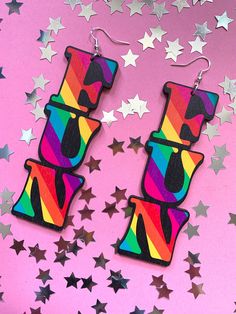 Life is too short to be beige, so spread a bit of fun wherever you go in these bright and bold statement earrings! Pump up the fun factor with these rainbow stripe mega earrings - literallyyy injecting some extra fun into your lewk - good times and good vibes guaranteed!  Made from laser cut birch ply wood, these are super light weight and comfortable to wear. Sterling silver hooks.  Measurements: 103mm height x 36mm width Please note the grain and texture of the wood may vary slightly from piece to piece. Playful Rainbow Earrings, Fun Rainbow Drop Earrings, Fun Rainbow Earrings For Summer, Fun Rainbow Earrings, Trendy Rainbow Party Earrings, Trendy Rainbow Earrings For Party, Trendy Rainbow Earrings For Summer, Ply Wood, Birch Ply