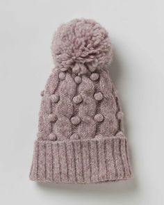 The Alicia Adams Alpaca Mimi Hat is the perfect alpaca beanie for fall and winter seasons. Crafted with artisanal techniques, this baby alpaca knit hat features a beautiful knit with stunning detail. Available in petal pink, frost blue, and admirals blue.100% baby alpaca | dry clean onlyProudly fair-trade made in Peru.Cashmere is not environmentally friendly and many people are allergic. Alpaca is sustainably sourced, easy on the environment, and hypoallergenic. Its fibers are also longer, and i Winter Wool Cable Knit Hat, Wool Cable Knit Hats For Cold Weather, Fall Wool Cable Knit Hat, Cozy Cable Knit Hats, Cozy Alpaca Hats For Fall, Knitted Alpaca Beanie For Fall, Fall Alpaca Knitted Beanie, Knitted Alpaca Hat For Fall, Cozy Cable Knit Crochet Hat For Fall