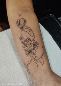 a woman's arm with a tattoo on it