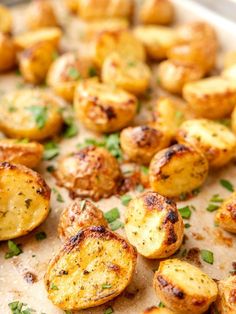 cooked potatoes on a baking sheet with parsley