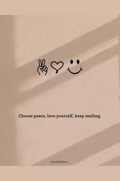 the words choose peace, love yourself, keep smiling are drawn on a white wall