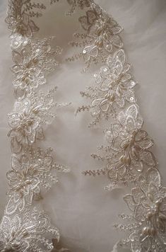 beaded Alencon Lace Trim, bridal alencon lace, wedding trim lace, scollaped lace trim, veil lace trim This amazing trim is specially for bridal gown, wedding dress, bridal veil. Super gorgeou alencon lace trim with scollaped trim, vintage style. Highly recommended for all brides ✿✿ＭＡＴＥＲＩＡＬ✿✿ alencon lace ✿✿ＭＥＡＳＵＲＥＭＥＮＴ✿✿ Width: Fixed width is 3.5 inches ✿✿ＣＯＬＯＲ✿✿ ivory ✿✿ＱＵＡＮＴＩＴＹ✿✿ This listing is for 1 yard ✿✿ＷＨＹ ＷＥ ＬＯＶＥ ＩＴ✿✿ ✿ Grace and antique design ✿ Elegant design, super poular with brides Elegant Lace Patchwork For Wedding, Elegant Wedding Lace With Patchwork, Fitted Lace Bridal Belt For Bride, Lace Wedding Dress With Lace Trim, Lace Bridal Accessories Fitted For Mother Of The Bride, Fitted Lace Bridal Accessories For Mother Of The Bride, Elegant Pearl Embroidered Lace For Wedding, Elegant Wedding Lace With Pearl Embroidery, Lace Wedding Dress With Lace Trim For Bride