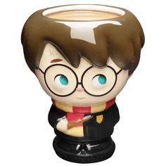 a harry potter mug with glasses on it's head and a red scarf around his neck