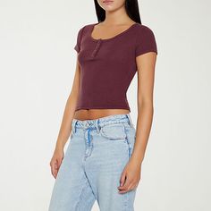 This cropped top from Forever 21's junior's and women's collection is essential for your casual styling. Made from soft cotton-knit, this henley-style t-shirt has a scoop neckline, a three-button placket, and short sleeves.Closure Type: Pullover HeadFit: FittedNeckline: Scoop NeckSleeve Length: Short SleeveFiber Content: 60% Cotton, 40% PolyesterCare: Machine Wash, Dry FlatCountry of Origin: Imported Fitted Casual Cropped T-shirt For Fall, Trendy Crop Top T-shirt For Fall, Trendy Fall Crop Top T-shirt, Everyday Fall Crop Top, Casual Scoop Neck Crop Top, Short Sleeve Crop Top For Fall, Casual Scoop Neck Tops For Fall, Casual Stretch Cropped T-shirt For Everyday, Trendy Solid Color Scoop Neck Cropped T-shirt