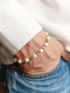 Mens real pearl bracelet, Gold crystal hematite y2k bracelet, Surfer gemstone beaded bracelet, Boyfriend gift ideas, Real pearl bracelet men   Pearls have long ceased to be in the arsenal of only women. Men easily complement their look with a classic string of pearls. It is not only fashionable and stylish, but also beautiful. Give this bracelet to your boyfriend, believe me, he will not remain indifferent. I only use natural freshwater pearls so I don't have perfect identical round beads like plastic ones. Each pearl, like a person, is unique, with its own life story, each bead has its own stripes - these are mother-of-pearl layers. And in combination with faceted hematite, such a bracelet will make you look modern, brutal and spectacular! Real freshwater rice pearls, faceted hematite wit Pearl Bracelet For Men, Couple Beaded Bracelets Pearl, Men’s Pearls, Spiritual Beaded Gold Pearl Bracelet, Men Pearls, Pearl Bracelet Men, Men’s Freshwater Black Pearl Bracelet, Boyfriend Gift Ideas, Real Pearl Bracelet