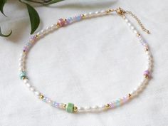 Pastel pearl necklace is so cute. In this beaded necklace, I have paired ceramic and glass seed beads in soft pastel colors, with genuine freshwater pearls and small 14k gold-plated beads. Lovely and pretty necklace, with a unique selection of beads.  The beading wire I use is high-quality stainless steel, composed of multiple twisted tiny wires that are nylon coated to protect the beads. The metal parts of this necklace are gold-plated/stainless steel. Also available silver-plated, just send me a message! The length of this necklace is 15 inches, with a 2 inches (5 cm) extension chain - so you can adjust the length of your necklace between 15 inches and 17 inches (38 - 43 cm). If you would like to have the necklace shorter or longer, just send me a message - I'm happy to personalize this Pastel Beaded Necklaces With Colorful Beads As Gift, Pastel Beaded Necklaces With Colorful Beads For Gifts, Pastel Beaded Necklaces As Gift, Pastel Colorful Beads Necklace For Gift, Pastel Pearl Necklace, Ceramic Bead Jewelry, Soft Pastel Colors, Pretty Necklace, Freshwater Pearl Necklace