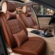 the interior of a car with brown leather seats