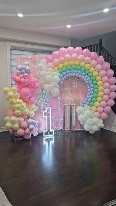 a room filled with balloons and decorations for a birthday or baby's first birthday