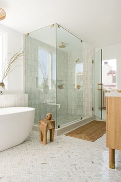 a bathroom with a tub, toilet and shower in it's own area is shown