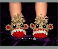 a pair of crocheted sockies that have been made to look like a doll's feet