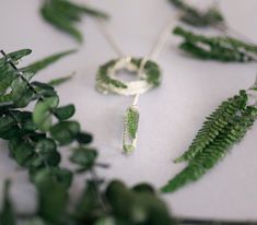 This necklace is formed of 2 different pieces made in clear resin, with real Ferns inside them, a Geode shaped and a pointed crystal. You can adapt it to your neck and wear it in different ways. Because the ferns are real, it can be sightly different from the original photos, but will always have the same quantity of leaves. Green Resin Pendant Necklace, Nature-inspired Green Pendant Crystal Necklace, Green Resin Round Pendant Necklace, Green Pressed Flower Round Pendant Jewelry, Green Pressed Flowers Round Pendant Jewelry, Fern Necklace, Pressed Flower Jewelry, Necklace Resin, Geode Slice