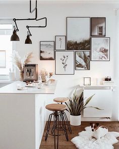 a white room with pictures on the wall