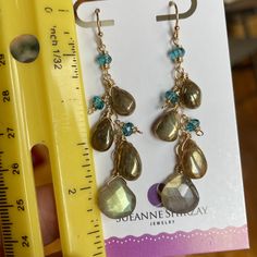 Labradorite comes in so many forms. These earrings are a combination of golden labradorite and gold/blue flash labradorite combined with apatite quartz rondelles. The wiring and chain is 14k gold filled . Please choose your earwire option. The approximate total length is 2 3/8”. Your jewelry will arrive beautifully giftboxed.