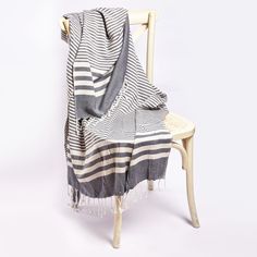 a chair with a blanket on top of it