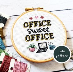 a cross stitch pattern with the words office week on it next to scissors and thread