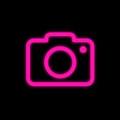 a neon pink camera on a black background