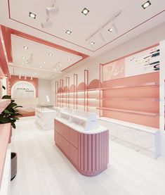 the interior of a store with pink and white accents on the walls, counter tops, and shelves