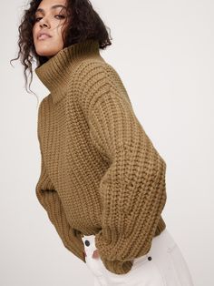 We designed this chunky-knit sweater with a funnel-neck and slouchy, cropped silhouette for a fresh and modern feel.  For fabric, we reached for one a new Italian Merino wool-blend yarn—one we love for its soft and cozy feel.  Relaxed fit with dropped shoulder seam.  Fabric from Italy's Filpucci Mill.  Funnel neck.  Straight hem.  Relaxed fit.  Long sleeves.  Cropped length.  Model: Size S, 5'10" (178cm). Italy Winter Outfits, Camel Sweaters, Chunky Knits Sweater, Outerwear Sweater, Funnel Neck, Cropped Sweater, Funnel, Chunky Knit, Family Photos