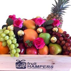 a wooden crate filled with lots of fruit