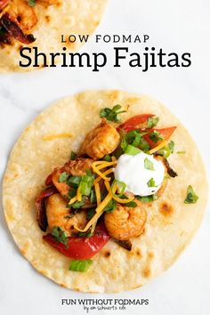 two shrimp fajitas with sour cream on top and the title overlay reads low fodmar shrimp fajitas