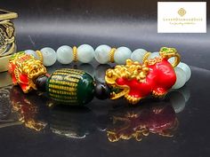 Gift yourself or your loveonce this beautiful bracelet. Crafted with 24 Karat Real Gold, Onyx, Agate and Angelite. Pixiu changes color. Metal: 24K Gold (Au999) Colour: Yellow Gold Gold Weight: Approximately 6.67grams Bracelet Width: Approximately 8mm Metal is Made of Real 24K Gold. Never Gold Filled. Never Gold Plated.  🧧Pixiu is a powerful Feng Shui symbol of wealth. It is believed that wearing the symbol of Pixiu brings money and good fortune to its wearer. This mythical creature is also thought to protect people from losing wealth. It also provides you not only physical protection, but also spiritual protection. 💥PLS FOLLOW US AND CHECK OUR OTHER LISTINGS. WE HAVE NEW STOCKS LISTED DAILY/WEEKLY.   OUR 24K GOLD IS MADE FROM 5G TECHNOLOGY What does 5G mean? 1, Grace : toughness, not eas Luxury Round Crystal Bracelet As Gift, Elegant Red Bracelets For Good Luck, Gold Jade Crystal Bracelet Gift, Flexible Round Bead Jewelry Gift, Red Jade Bracelet As Gift, Red Jade Bracelet Gift, Flexible Beaded Bracelets As A Gift, Traditional Hand-strung Good Luck Bracelets, Yellow Gold Jade Bracelets As Gift