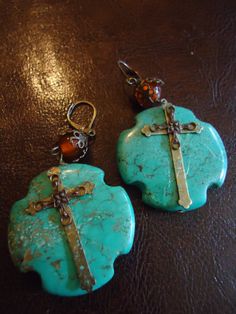 Southwestern Inspired One of a kind handcrafted earrings. Beautiful vintage colored filigree bead cap with tangerine colored bead in detail.  Turquoise with mission cross details 1 1/2 inches wide and 1 1/2 inches across. Weighs 7 oz per earrings, length 2 3/4 inches including ear wires. These simply draws the eyes in. New, Never worn, One of a kind. Tangerine Color, Turquoise Cross, Turquoise Heart, Heart Drop Earrings, Handcrafted Earrings, Southern Style, Bead Caps, Turquoise Earrings, Vintage Colors