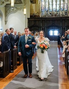 the bride and groom are walking down the aisle