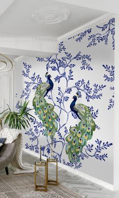 the peacocks are painted on the wall in this room