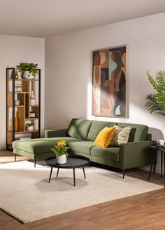 a living room filled with furniture and a painting on the wall