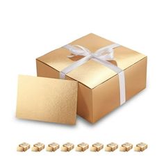 a gold gift box with white ribbon and 10 pieces of chocolate