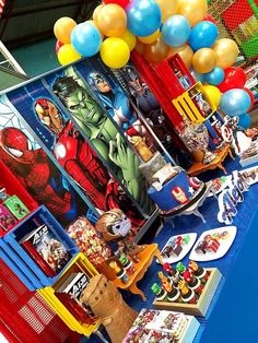 the table is set up with balloons and other items for children's birthdays