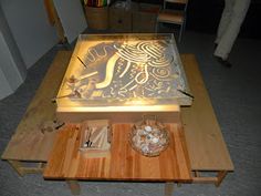 a wooden table topped with a metal tray