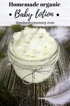 homemade organic baby lotion in a mason jar with feathers on the side and text overlay