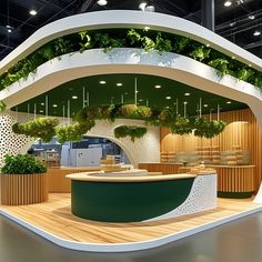 an exhibition stand with green plants on it