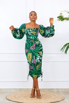 Beautiful Ankara Dress Bubble sleeves that can be worn on or off-the-shoulder Sweetheart neckline Drawstrings on both sides to take dress to short or longer length. Exaggerated sleeves with a cuff. Made with High quality 100% African Wax cotton Fully Lined upper Bodice Long zipper at the back for easy wear Made in Nigeria Models are wearing a US6/UK10 and US12/UK16 CARE INSTRUCTIONS: Hand wash cold, DO NOT BLEACH, Hang dry, Press with cool iron on the wrong side only. Ankara Dress With Puff Sleeves, Sweetheart Neckline Ankara Dress, Drawstring Ankara Dress, Ankara Drawstring Dress, Ankara Long Sleeve Dress, Beautiful Sleeves Designs For Dresses, Nigerian Styles Dresses Ankara, Ghanian Dress Styles, Easy Ankara Dress