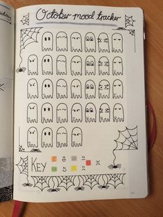 an open notebook with halloween stickers on it