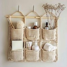 a wall hanging organizer with baskets and bottles