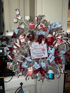 a wreath made out of many different items in the shape of a christmas ornament