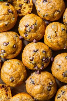 whole wheat mini pumpkin muffins with chocolate chips and pecans in the middle