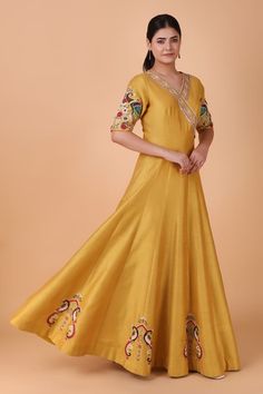 Mustard yellow floor length anarkali with placement floral, twin peacock motif embroidery using pearl, sequins. Paired with a blue dupatta with all over ikat pattern, cutdana and gota patti. - Aza Fashions V Neck Anarkali, Yellow Floor, Anarkali With Dupatta, Peacock Motif, Floor Length Anarkali, Placement Embroidery, Blue Dupatta, Motif Embroidery, Embroidered Anarkali