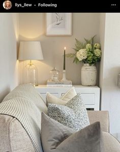 a living room filled with furniture and flowers