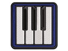 an embroidered patch with three piano keys in blue and white on a black border,