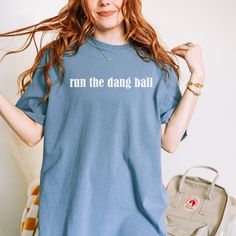 *Also available as a sweater. See below.* Stay warm and show your team pride with our Run the Dang Ball T-Shirt. Perfect for Bulldogs fans, it features the iconic phrase and references our beloved UGA football team. Get ready to cheer them on in style! Uga Football, Football Team, Medium Blue, Stay Warm, In Style, Blue Jeans, Bulldog, Football, Running