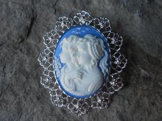 Wonderful gifts!!!  2 in 1, Brooch and pendant!!! Beautifully detailed white on blue, mother and daughter, sisters, or best friends!!! Gorgeous!!!  The cameo is set in a gorgeous silver plated brooch/pendant setting (about 2 1/4" long)!!! Timeless look!!!  Thanks!!!  Lisa... Blue Oval Brooch For Gifts, Blue Cameo Jewelry Gift, White Oval Brooches For Gifts, Blue Cameo Jewelry For Wedding, White Pendant Brooch Gift, Creepy Baby Dolls, Cameo Pendant Necklace, Goth Accessories, Filigree Bracelet