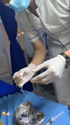 a nurse is performing surgery on a patient's arm in an incisional unit