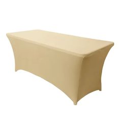 a table covered in a beige cloth