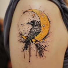 a black bird sitting on top of a yellow moon